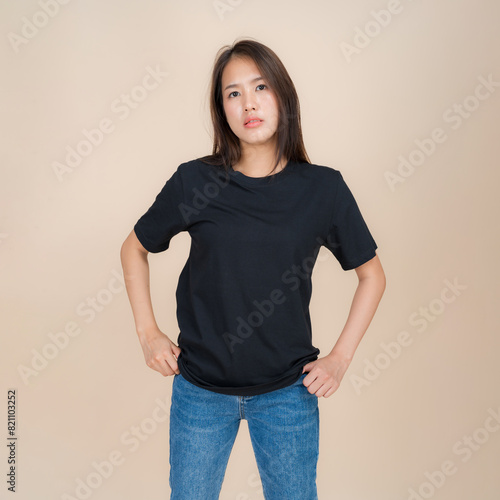 Young woman in casual black t-shirt and jeans