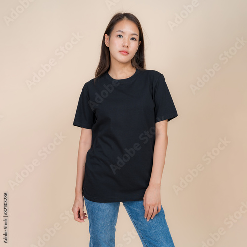 Young woman in casual black t-shirt and jeans