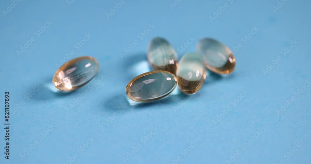 transparent tablets with liquid for treatment, transparent medicines on a blue background transparent tablets with liquid for treatment, transparent medicines on a blue background