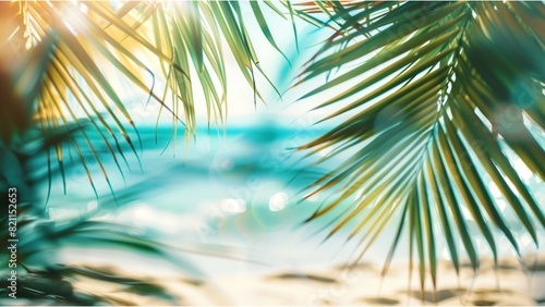 Tropical beach background with palm leaves and white sand  blurred ocean view. Summer vacation concept