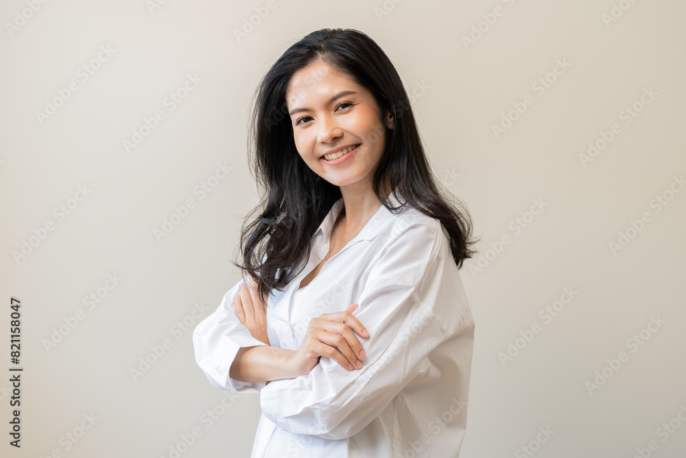 Smile positive, happy asian young woman wearing casual shirt, portrait of beautiful female with black long hair feeling prond, standing crossed arms looking at camera, isolated on white background. Smile positive, happy asian young woman wearing casual shirt, portrait of beautiful female with black long hair feeling prond, standing crossed arms looking at camera, isolated on white background.