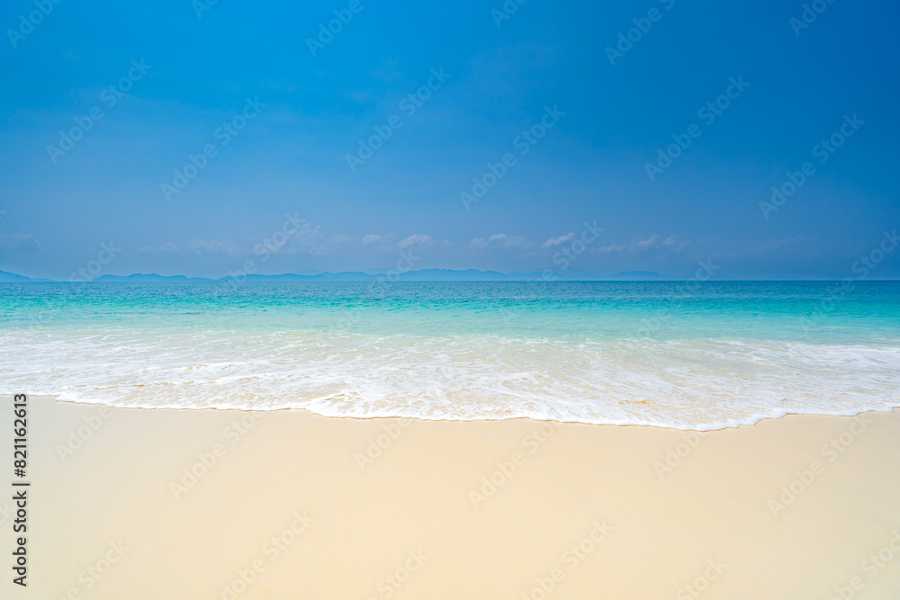 Clean white sandy beach welcoming blue waters on a clear day, Phuket Island, Thailand, Asia