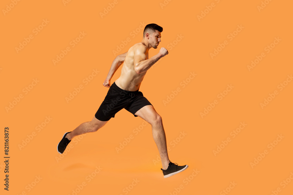 A man in motion, running energetically on a vibrant orange background. His strides are powerful and determined, creating a sense of speed and urgency.