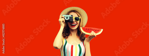 Summer portrait happy smiling young woman with film camera and slice of fresh watermelon wearing hat