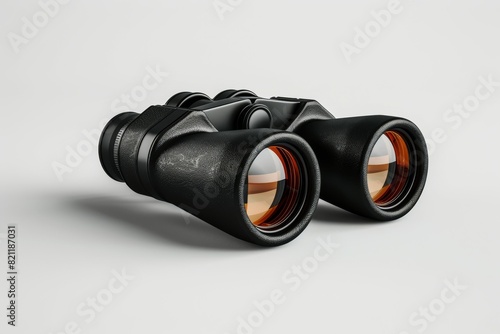 A pair of binoculars with a black frame and orange lenses photo