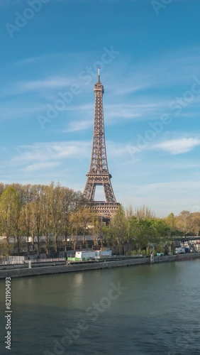 Paris France time lapse city skyline at Eiffel Tower and Seine River Debilly Footbridge (Vertical) photo