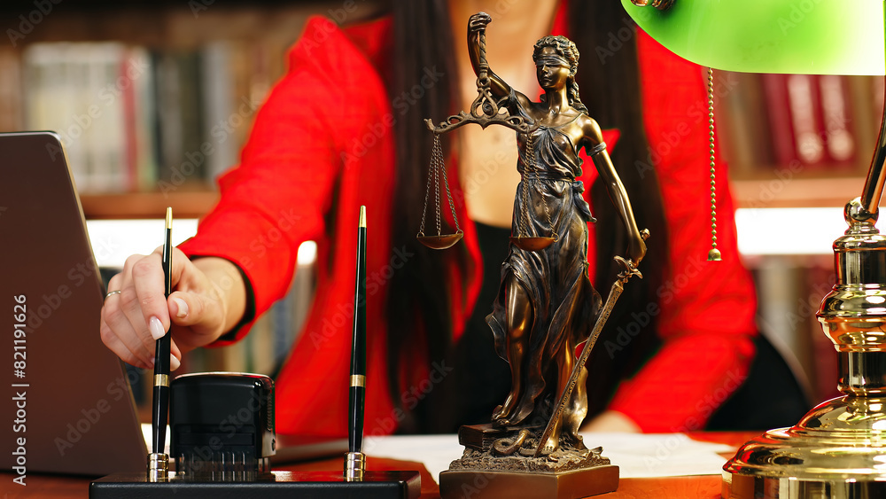 Naklejka premium Justice and law concept. Lawyer works with laptop in court office. Concept of legal work, litigation.