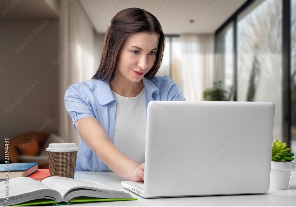 Smiling pretty young woman searching for information Smiling pretty young woman searching for information