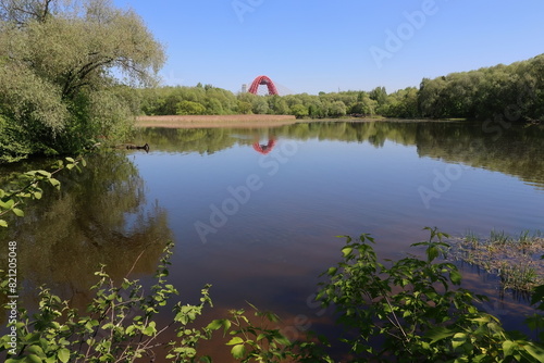 landscape of the lake with the arch of the bridge on the horizon photo