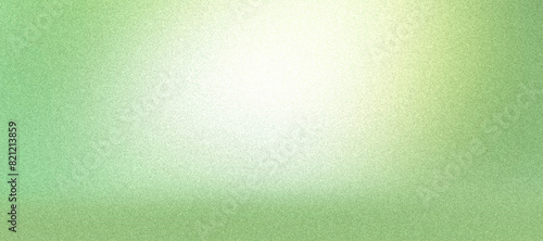 Soft green background with illuminated center, rough texture, grainy noise.