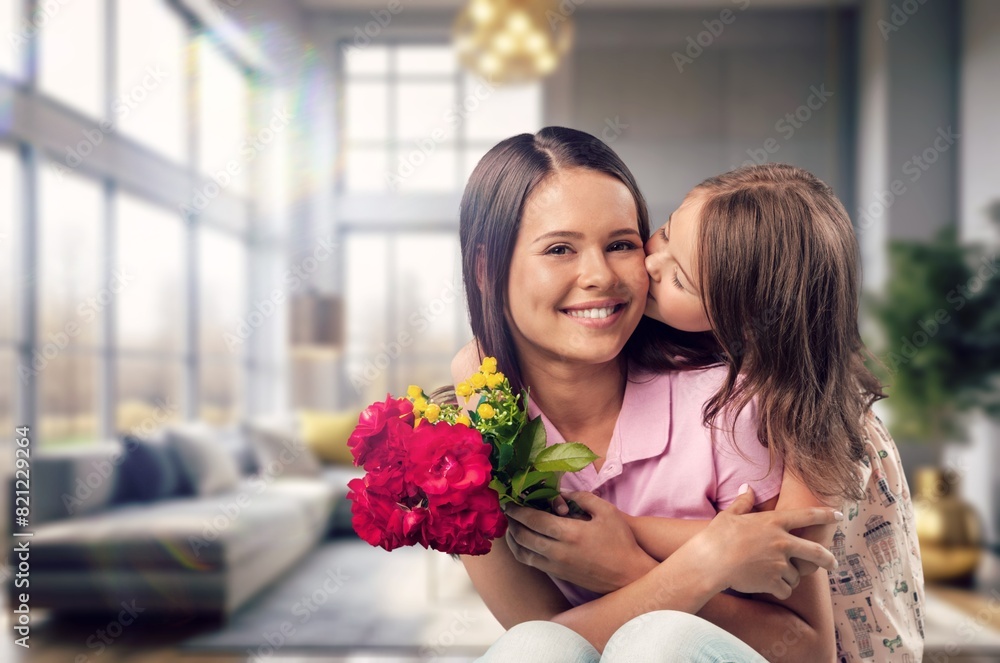 Happy mother and Child congratulating with bouquet of flowers. Happy mother and Child congratulating with bouquet of flowers.