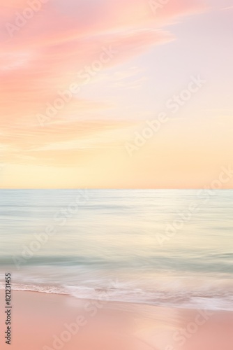 Pastel sunrise over calm ocean. The photo depicts a serene scene with soft pink and yellow hues in the sky reflecting. Vertical image with copy space.. soft foto