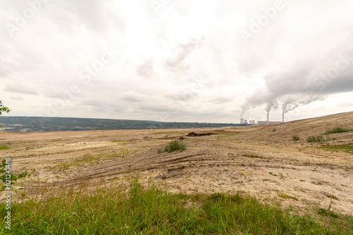 Coal-fired power plant and open-pit mine in Be  chat  w  Poland.