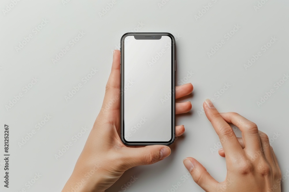 A person is holding cell phone with a black case and a white screen A person is holding cell phone with a black case and a white screen