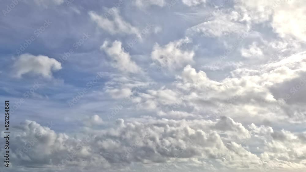 A serene skyscape, with fluffy cumulus clouds scattered across a soft blue sky, hinting at tranquility and vastness. Dynamic cloud formation against a calming blue backdrop. A serene skyscape, with fluffy cumulus clouds scattered across a soft blue sky, hinting at tranquility and vastness. Dynamic cloud formation against a calming blue backdrop.