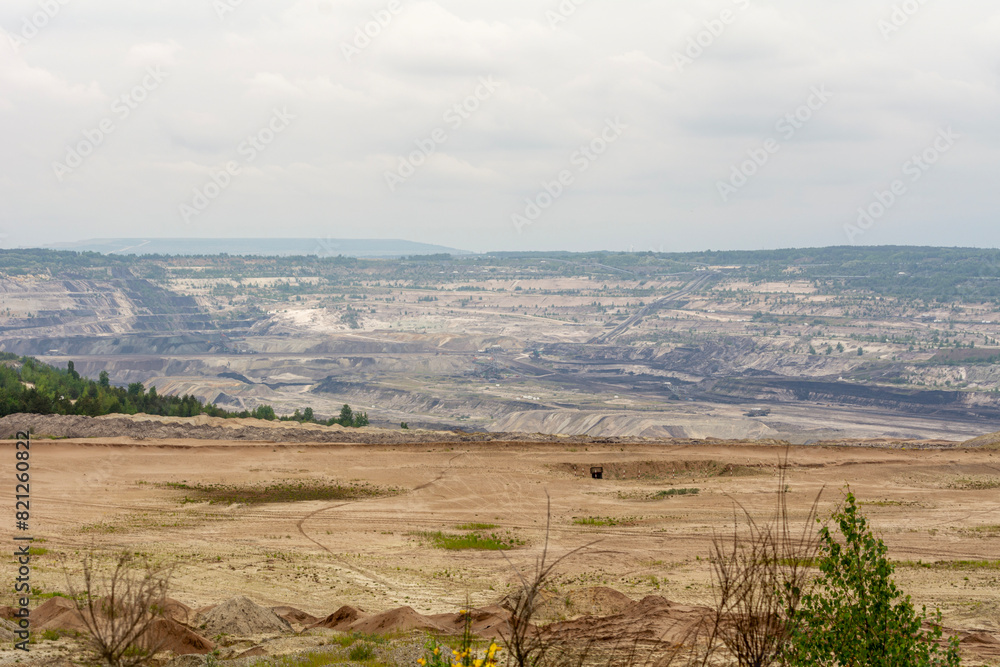 Obraz premium Coal-fired power plant and open-pit mine in Bełchatów, Poland.