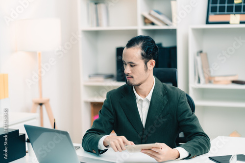 Asian businessman present s...