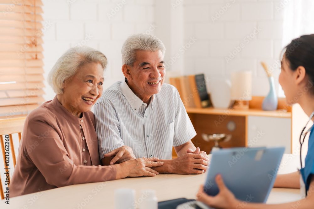 Happy Senior Asian Woman Receives Medical Care at Home, Doctor or Caregiver Nurse Provide Support Assistance, Enhancing Healthcare Services for Elderly Patients Retirement Happy Senior Asian Woman Receives Medical Care at Home, Doctor or Caregiver Nurse Provide Support Assistance, Enhancing Healthcare Services for Elderly Patients Retirement