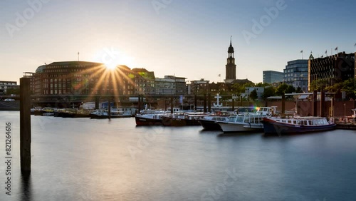 HAMBURG, GERMANY - May. 12th, 2024: time lapse, sunset at Hamburg harbor with St. Michael's Church colloquially called Michel photo