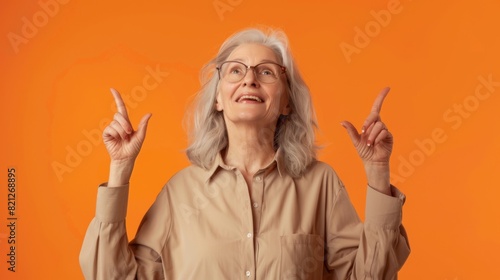 Woman Pointing Upwards Joyfully photo
