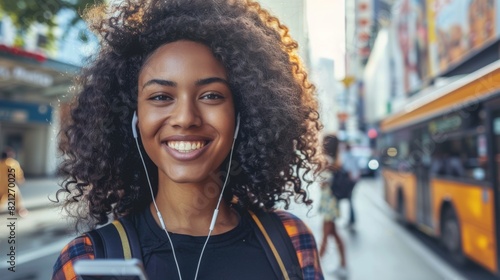 Smiling Woman with Headphones in City © ArtemRich