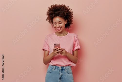 Woman in Pink Shirt Looking at Cell Phone