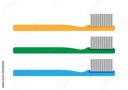 Cepillos de diente naranja, azul y verde.