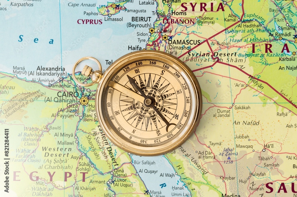 Magnetic old retro compass at world map. Magnetic old retro compass at world map.