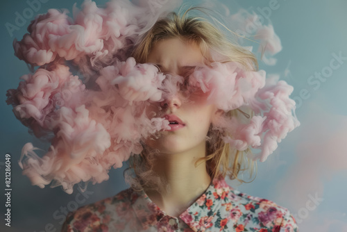 dreamlike portrait of young woman with pink smoke clouding her vision