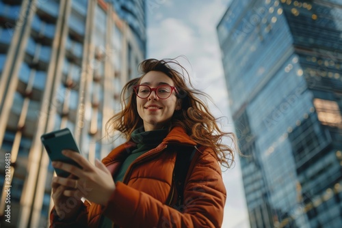 Woman Wearing Glasses Looking at Cell Phone