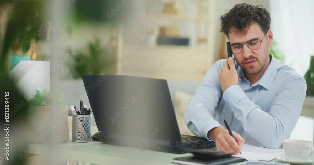 Busy Man Talking on Phone and Emailing Busy Man Talking on Phone and Emailing