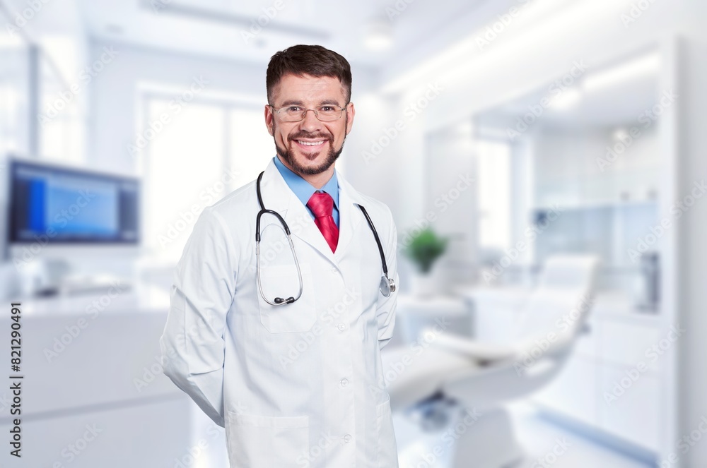 Professional young doctor posing in a dental clinic. Professional young doctor posing in a dental clinic.