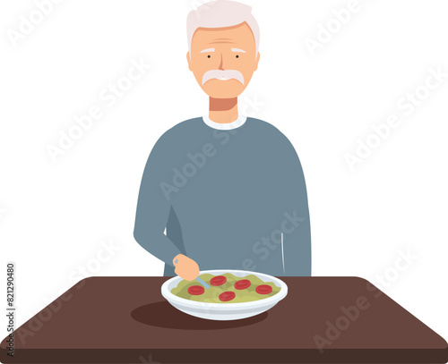 Senior man with a plate of healthy food in front of him, sitting alone at a table