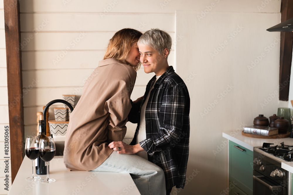 Two beautiful lesbians young women girls kissing on romantic date, two girlfriends showing love and passion. LGBT relationship Two beautiful lesbians young women girls kissing on romantic date, two girlfriends showing love and passion. LGBT relationship