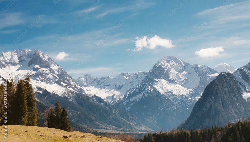 Snow-capped mountains against a clear blue sky