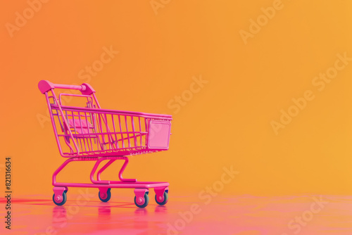 Vibrant Pink Shopping Cart on Orange Background