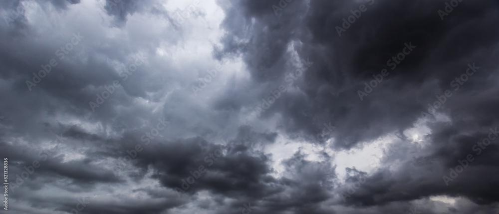 The dark sky with heavy clouds converging and a violent storm before the rain.Bad or moody weather sky and environment. carbon dioxide emissions, greenhouse effect, global warming, climate change. The dark sky with heavy clouds converging and a violent storm before the rain.Bad or moody weather sky and environment. carbon dioxide emissions, greenhouse effect, global warming, climate change.