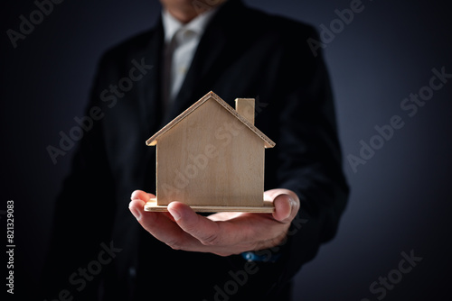 the businessman holding a piggy bank, donation, charity, fundraising, superannuation, investment, saving, family finance plan concept, Money Saving Ideas for Buying a Home.