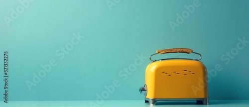 A single toaster on a solid color backdrop with copy space