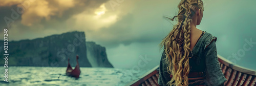 Female Viking Warrior Disembarking from a Long Ship photo