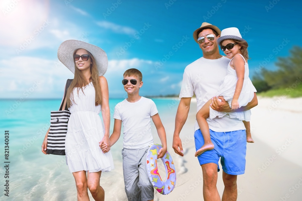 Happy family fun together on a sandy beach Happy family fun together on a sandy beach