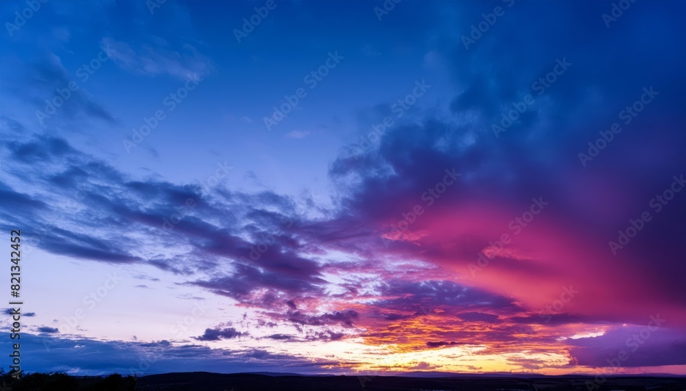 Majestic sunset with a spectrum of pink and purple hues painting the cloudfilled sky Majestic sunset with a spectrum of pink and purple hues painting the cloudfilled sky