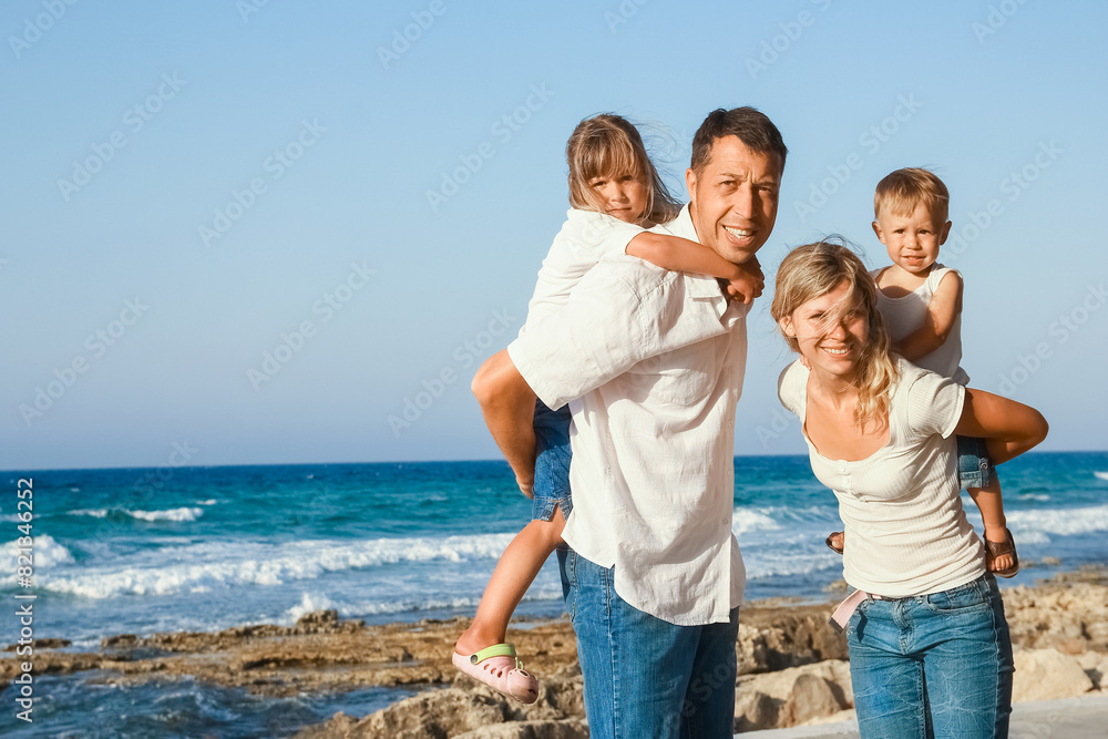 A happy family playing by the sea in nature travel A happy family playing by the sea in nature travel