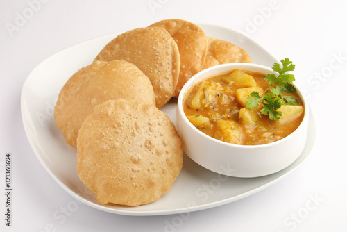 Puri Bhaji North Indian Poori with aalu bhaji aalu sabji potato spicy recipe breakfast food a deep fried bread of whole wheat flour. poori masala in restaurant Kerala Rajasthan Delhi India Sri Lanka.
