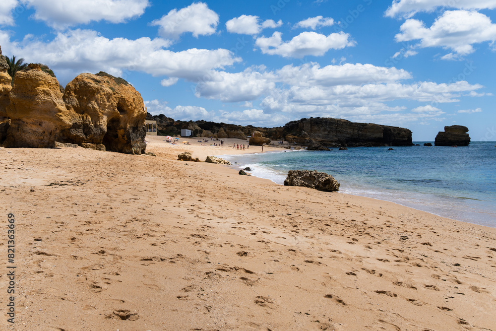 São Rafael beach, Albufeira, Algarve, Portugal. Sunny day. Rocks and cliffs on the beach. Crystal clear sea
