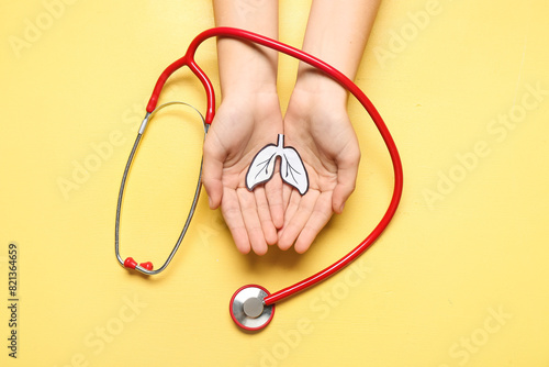 Female hands with paper lun...