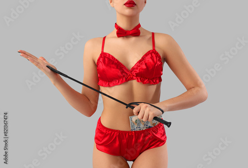 Young prostitute with whip ...