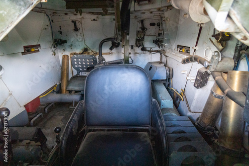 Old abandoned rusty military truck interior.