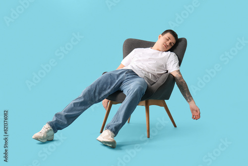Tired young man sleeping in...