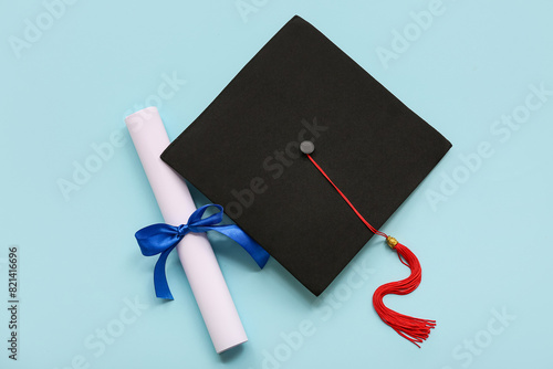 Diploma with blue ribbon an...